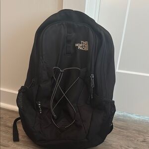 The North Face Black Backpack with Bungee Cord Design